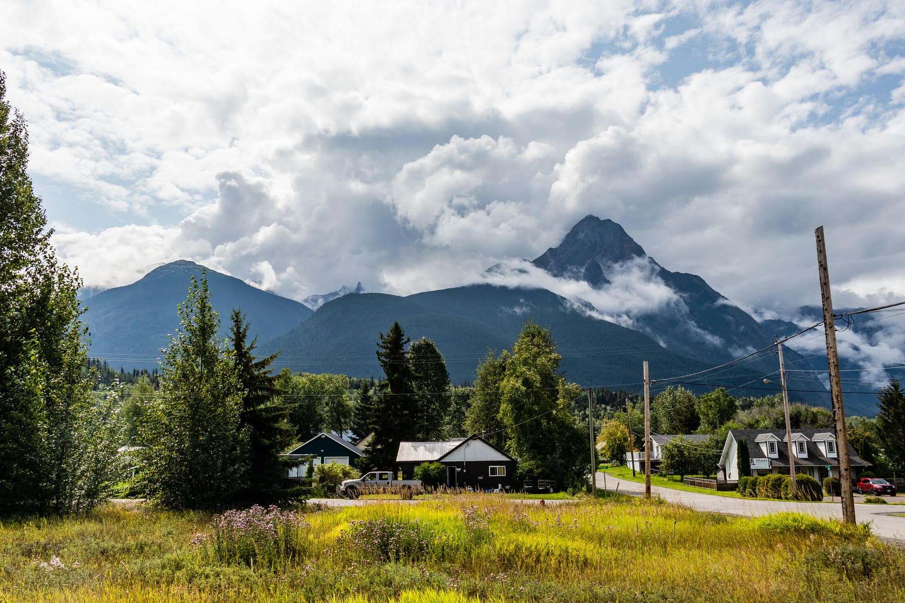 Homes in Hazelton below Stekyoden, with the peak in the clouds